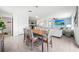 Open-concept dining area seamlessly connects to the kitchen and living room for easy entertaining and everyday living at 3027 Great Abaco Way, Bradenton, FL 34208