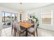 Dining room with view to pool and outdoor living area for seamless indoor-outdoor living at 3027 Great Abaco Way, Bradenton, FL 34208