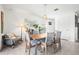 Bright dining room with modern lighting and decor creating an inviting atmosphere for meals and entertaining at 3027 Great Abaco Way, Bradenton, FL 34208