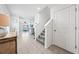 Bright entryway featuring tile floors, staircase, and a glimpse of the living area, creating a welcoming first impression at 3027 Great Abaco Way, Bradenton, FL 34208