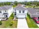 Beautiful two-story home with a well-manicured lawn, ample driveway, and attached two-car garage at 3027 Great Abaco Way, Bradenton, FL 34208