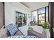 Relaxing screened lanai featuring sliding glass door entry, ceiling fan, and view of backyard at 3027 Great Abaco Way, Bradenton, FL 34208