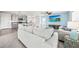 An open-concept living room and kitchen that allows for easy flow and interaction at 3027 Great Abaco Way, Bradenton, FL 34208