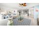 A bright living room adjacent to kitchen with modern decor and an open floor plan at 3027 Great Abaco Way, Bradenton, FL 34208