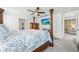 Expansive primary bedroom featuring elegant furnishings and a ceiling fan, offering a peaceful retreat at 3027 Great Abaco Way, Bradenton, FL 34208