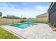 Backyard view of the pool with fountains, patio area and privacy fence at 3027 Great Abaco Way, Bradenton, FL 34208