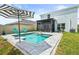 Stunning backyard oasis with a sparkling pool, umbrella, and ample space for entertaining at 3027 Great Abaco Way, Bradenton, FL 34208