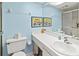 Bathroom featuring a single sink vanity, toilet, and a framed glass shower at 305 30Th Ave W # A104, Bradenton, FL 34205