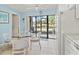 Breakfast nook featuring table, chairs, and sliding glass doors to patio at 305 30Th Ave W # A104, Bradenton, FL 34205