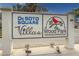 Entrance sign for De Soto Square Villas in Wood Park, displaying the community name and logo at 305 30Th Ave W # A104, Bradenton, FL 34205