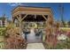 Charming lakeside gazebo with seating, providing a relaxing spot at 305 30Th Ave W # A104, Bradenton, FL 34205