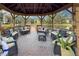 Lakeside gazebo interior offering comfortable seating and scenic water views at 305 30Th Ave W # A104, Bradenton, FL 34205