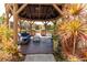 Inside a lakeside gazebo featuring comfortable seating and a peaceful atmosphere at 305 30Th Ave W # A104, Bradenton, FL 34205