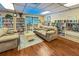 Cozy library with bookshelves, comfortable seating and a variety of reading materials at 305 30Th Ave W # A104, Bradenton, FL 34205