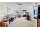 Bright living room showcasing carpet, ceiling fan and open concept at 305 30Th Ave W # A104, Bradenton, FL 34205