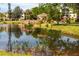 Beautiful view of a pond with a gazebo and lush landscaping surrounding the water at 305 30Th Ave W # A104, Bradenton, FL 34205