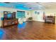 Spacious recreation room featuring a large television, comfortable seating, and classic piano at 305 30Th Ave W # A104, Bradenton, FL 34205