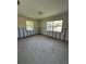 Bedroom with ample natural light and needing remodel to the buyer's taste at 305 59Th St, Holmes Beach, FL 34217