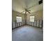Bedroom with ceiling fan, ample natural light and needing remodel to the buyer's taste at 305 59Th St, Holmes Beach, FL 34217
