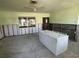 Spacious kitchen needing remodeling, with ceiling fan and natural light at 305 59Th St, Holmes Beach, FL 34217