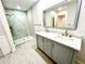 Updated bathroom featuring modern vanity, glass shower, and luxury finishes at 3320 Riviera Dr, Sarasota, FL 34232