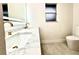 Bathroom featuring double vanity, marble countertop, and modern finishes at 3320 Riviera Dr, Sarasota, FL 34232