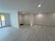 Bright and open living room featuring neutral walls and modern flooring at 3320 Riviera Dr, Sarasota, FL 34232