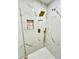Modern glass shower with beautiful marble tiling, rainfall shower head and built in shelf at 3320 Riviera Dr, Sarasota, FL 34232