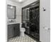 Contemporary bathroom with a black-and-white color scheme, featuring a sleek glass-enclosed shower at 3333 Ramblewood Pl, Sarasota, FL 34237