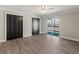 Bright bedroom features two large closets, sliding glass doors to the outside and durable vinyl plank flooring at 3333 Ramblewood Pl, Sarasota, FL 34237