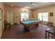 Billiards room featuring a pool table, chairs, and ample lighting at 3333 Ramblewood Pl, Sarasota, FL 34237