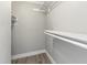 Walk-in closet with built-in shelving at 3333 Ramblewood Pl, Sarasota, FL 34237