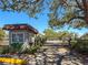 Exterior view of a community gatehouse at the property entrance at 3333 Ramblewood Pl, Sarasota, FL 34237