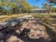 Outdoor picnic area with tables and a bench for community residents at 3333 Ramblewood Pl, Sarasota, FL 34237
