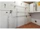 A utility room with water heater and shelving for storage at 3333 Ramblewood Pl, Sarasota, FL 34237