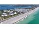 Aerial view of beachfront property and beach access with stunning waterfront scenery and nearby local neighborhood at 3802 Gulf Of Mexico Dr # A103, Longboat Key, FL 34228