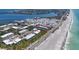 Aerial shot of a condo complex situated on the beach near a waterway and residential area at 3802 Gulf Of Mexico Dr # A103, Longboat Key, FL 34228