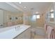 A well-maintained bathroom featuring a shower/tub combo and a neutral color scheme at 3802 Gulf Of Mexico Dr # A103, Longboat Key, FL 34228