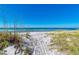 Scenic beach view featuring calm water and clear sky at 3802 Gulf Of Mexico Dr # A103, Longboat Key, FL 34228