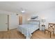 A sunlit bedroom offering a ceiling fan and a modern color palette at 3802 Gulf Of Mexico Dr # A103, Longboat Key, FL 34228