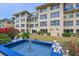 A condo features a fountain and lush landscape in its well-maintained outdoor space at 3802 Gulf Of Mexico Dr # A103, Longboat Key, FL 34228