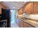 Updated kitchen with granite countertops, stainless steel sink and appliances at 3802 Gulf Of Mexico Dr # A103, Longboat Key, FL 34228