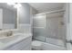 A clean bathroom features a tiled shower, modern vanity, and neutral color palette at 415 63Rd St, Holmes Beach, FL 34217