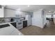 An efficient kitchen with white cabinets, gray lower cabinets, and modern appliances at 415 63Rd St, Holmes Beach, FL 34217