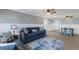 Spacious living room and dining area with tiled floors, ceiling fans, and a comfortable seating area with contemporary decor at 415 63Rd St, Holmes Beach, FL 34217