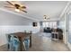Spacious living and dining area showcasing tile flooring, ceiling fans, comfortable seating, and contemporary decor at 415 63Rd St, Holmes Beach, FL 34217