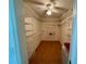Walk-in closet featuring custom adjustable wire shelving and tile floor at 417 Firethorn Ave, Englewood, FL 34223