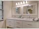 Elegant bathroom vanity with double sinks, marble countertops, and ample storage space at 4375 Trails Dr # 17-1, Sarasota, FL 34232