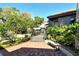 Well-maintained front yard with brick patio and lush landscaping, creating a welcoming entrance at 4375 Trails Dr # 17-1, Sarasota, FL 34232