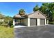 Three-car garage with ample parking space and covered walkway to the front door at 4375 Trails Dr # 17-1, Sarasota, FL 34232